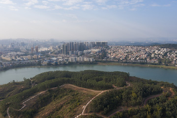 Obraz premium Forest river bank and urban architectural landscape