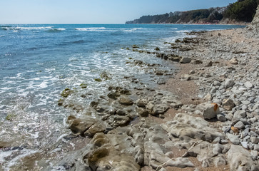 Fantastic rock formations north of the beach under the huge stone massifs of the resort. The Black Sea.  Byala, Bulgaria.