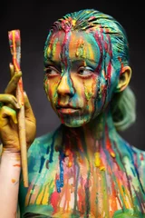 Foto auf Acrylglas Junge Frau bedeckt mit einer bunten Farbe © Nejron Photo