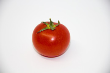 red homemade tomato on a white background