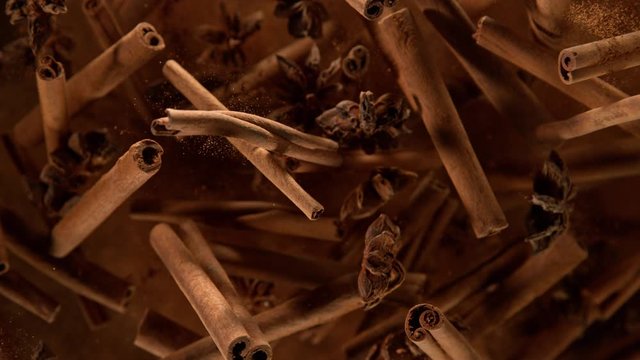 Super Slow Motion Shot of Cinnamon, Star anise and Powder Explosion on Black Background at 1000fps.