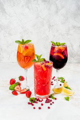 Lemonades from orange, strawberries in one frame
