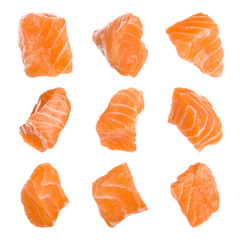 Set with pieces of fresh raw salmon on white background. Fish delicacy