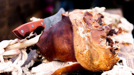 Tasty smoked meat with spaces and knife