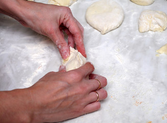 Girl sculpts homemade pies with potatoes