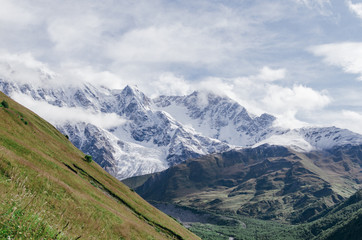 Fototapeta na wymiar Peak Shkhara Zemo Svaneti, Georgia. The main Caucasian ridge