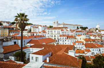 Lisbon, Portugal - May, 22nd, 2018 : High angle view of the Alfama old town as seen from the Miradouro das Portas do Sol viewpoint.