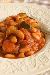 Tuscan bean soup made with cannellini beans zucchini and Italian sausage
