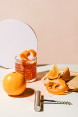 Summer cocktail with orange and lemon slices. Plug puller besides. Abstract studio conception.