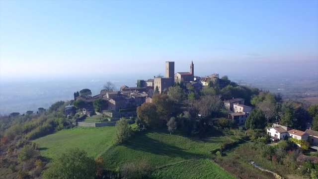 4k aerial forward drone footage on the antique village of Rivanazzano, in Oltrepò Pavese countryside near Pavia, Italy.
