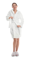 Young woman in bathrobe on white background