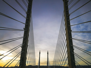 Fototapeta premium Towers of Bridge connecting George Town on Penang island and Seberang Prai on mainland of Malaysia through straits of Malacca.