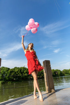 Girl In Red Polka Dot Dress With Balloons