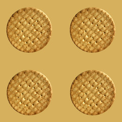 Seamless pattern with biscuits on the brown background