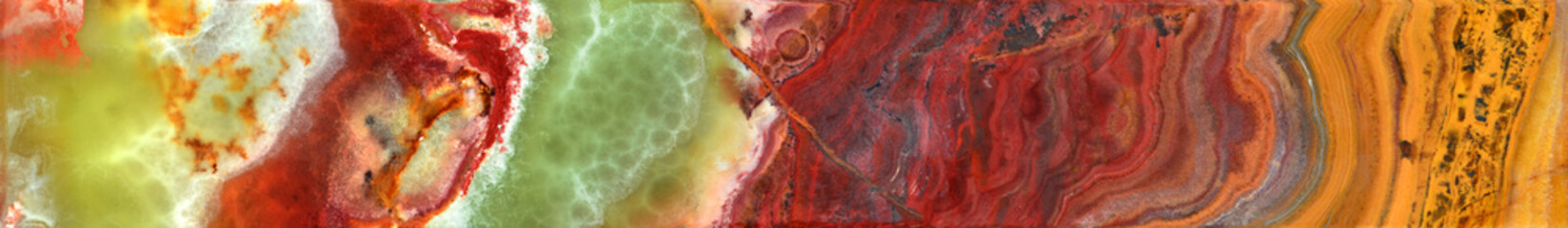 Onyx texture of the surface of a beautiful stone. Variety of agate. Green, brown, red, white,...