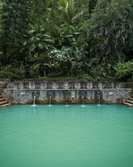 Beautiful stone pool with hot springs in the jungle of Bali