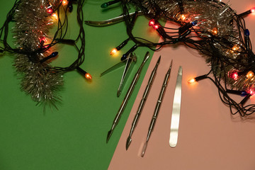 nail scissors file and clippers to remove the cuticle care products on a light background