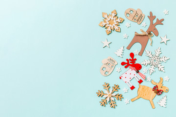 Top view of holiday decorations and toys on blue background. Christmas ornament concept with empty space for your design