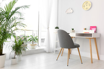 Stylish room interior with beautiful plants. Home design idea