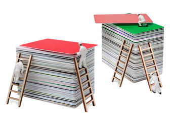 People-dolls work in a warehouse of plastic cards. Isolated on white background.