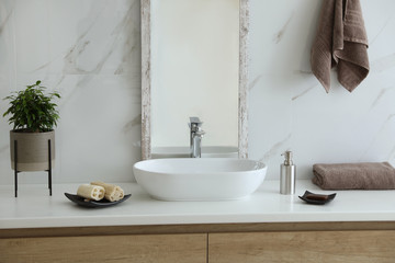 Obraz na płótnie Canvas Modern bathroom interior with stylish mirror and vessel sink