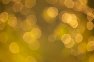 Abstract background of soft golden bokeh