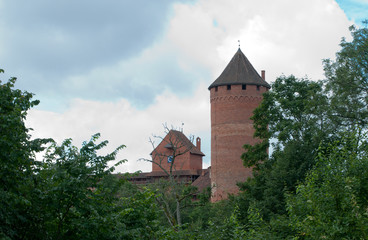 Fototapeta na wymiar Sigulda Latvia, view of towers at Turaida Castle behind the trees