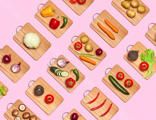 Fresh vegetables on wooden chopping boards