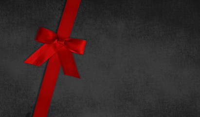 Red ribbon on black background