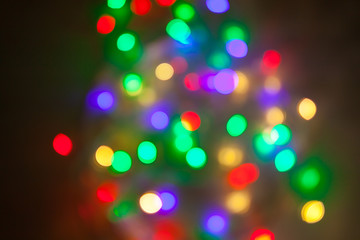 Abstract Christmas background. Photo of glowing blurry lights. Decoration garland with...
