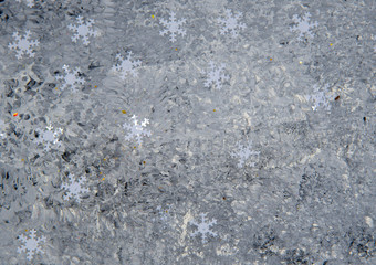 Speckled gray background with snowflakes. Christmas background.