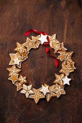 Christmas Gingerbread cookies wreath on old wooden table