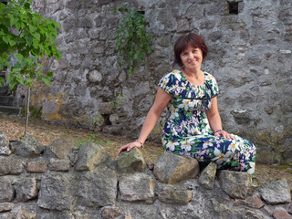 beautiful woman in the summer on the street of the old town ARKUA PETRARKA, ITALY