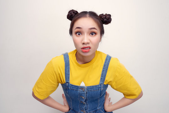 Close up photo beautiful amazing she her lady two hair buns ugh facial expression look disgusted side empty space wear casual t-shirt jeans denim overalls clothes isolated white background