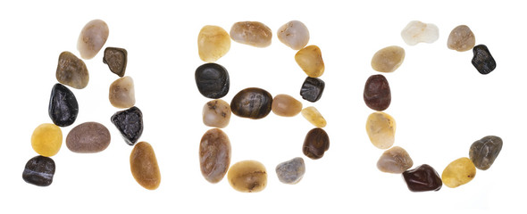 A B C (alphabet) hand-made letters with stones (boulders, rolling stones). Typography Collection. Isolated on white background