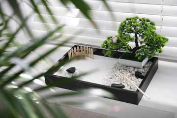 Beautiful miniature zen garden on window sill