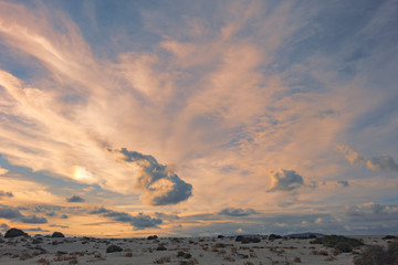 Dramatic cloudscape with low sun over the natural park in Corralejo in the Canary Islands,Las Palmas,Spain