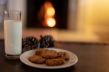 Cookies and milk on table at Christmas time