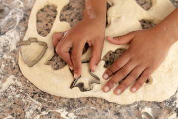Girl making Christmas cookies at home