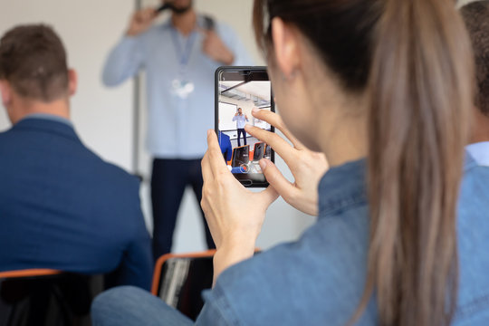 Business professionals at a conference - Powered by Adobe