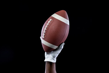 man holding american football