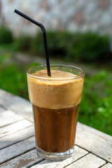 Traditional greek cold coffee Frappe made from water, instant coffee and ice cubes
