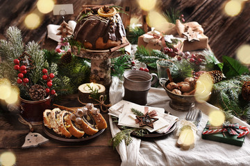 rustic style table with Christmas Eve wafer and traditional cakes - obrazy, fototapety, plakaty