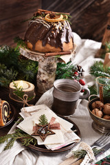 rustic style table with Christmas Eve wafer and traditional cakes