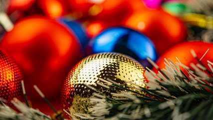 Abstract blurred colored background - holiday balls on the table.