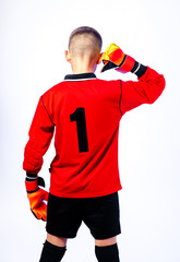 young soccer players in goalkeeper gloves on a light background