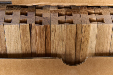 Joinery. Furniture wooden parts stacked together in carton box