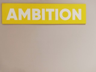 Written: "ambition" on a yellow background