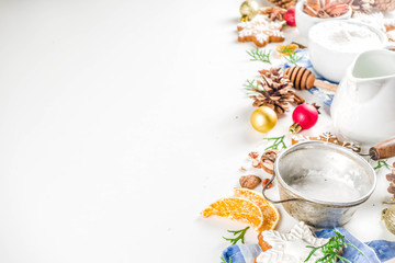 Christmas baking background. Christmas sweet cooking ingredients on white table. Ingredient for cooking christmas pastry, cookies and cakes, Flatlay on white table, top view with copy space