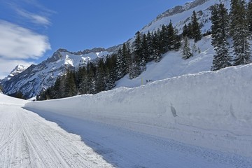 Fototapeta na wymiar winter mountain road and snow walls